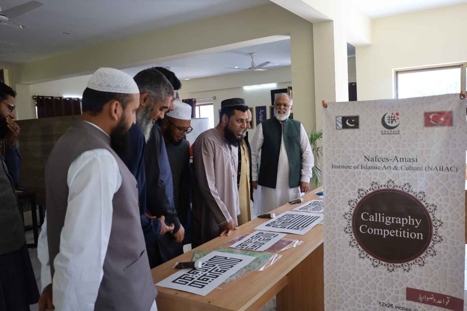 Calligraphy competition highlights at Khubaib Calligraphy Center showcasing beautiful artistic styles.