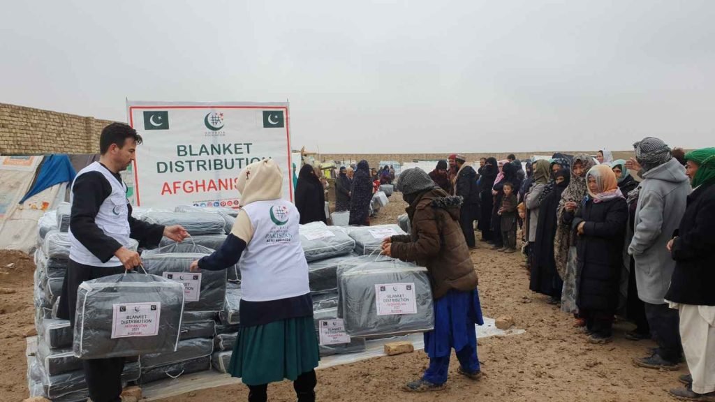 Blanket distribution event in Afghanistan providing crucial support to vulnerable communities.
