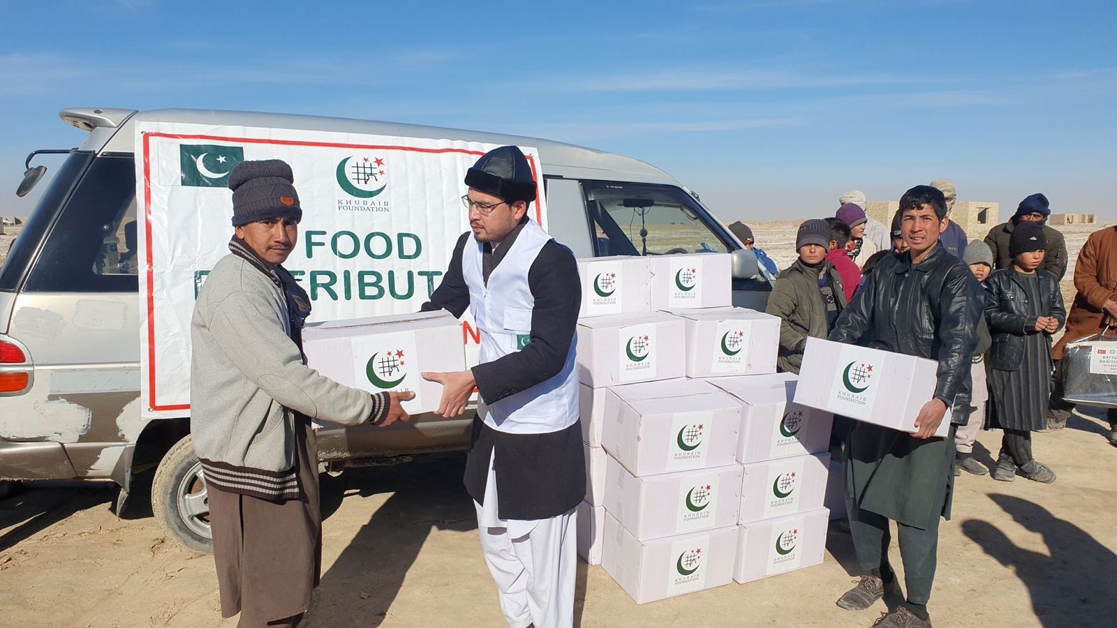 Khubaib Foundation volunteers distributing food boxes in Afghanistan.