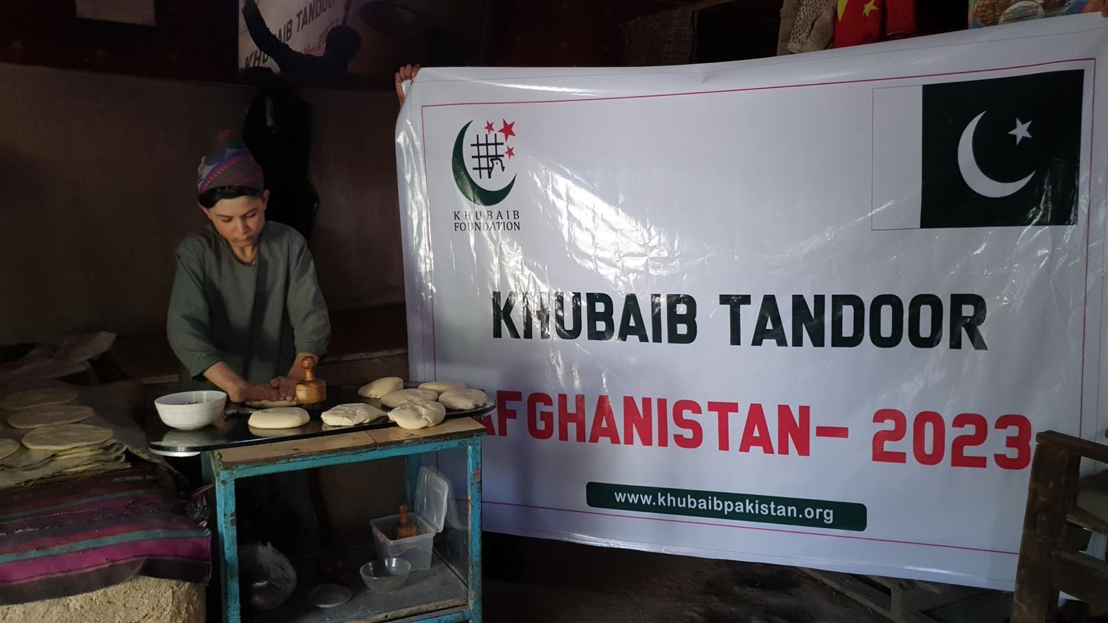 Worker preparing dough for Khubaib Tandoor relief in Afghanistan.