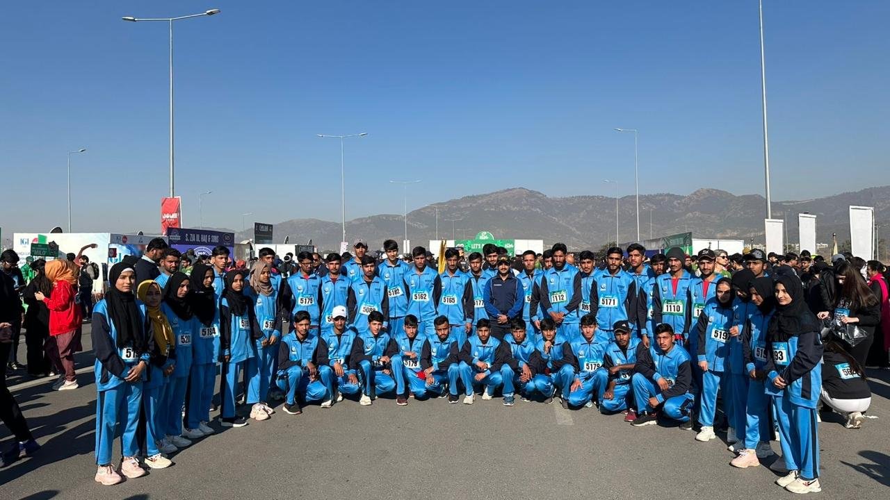 Runners at the Khubaib Marathon in Islamabad, showcasing athletic spirit.