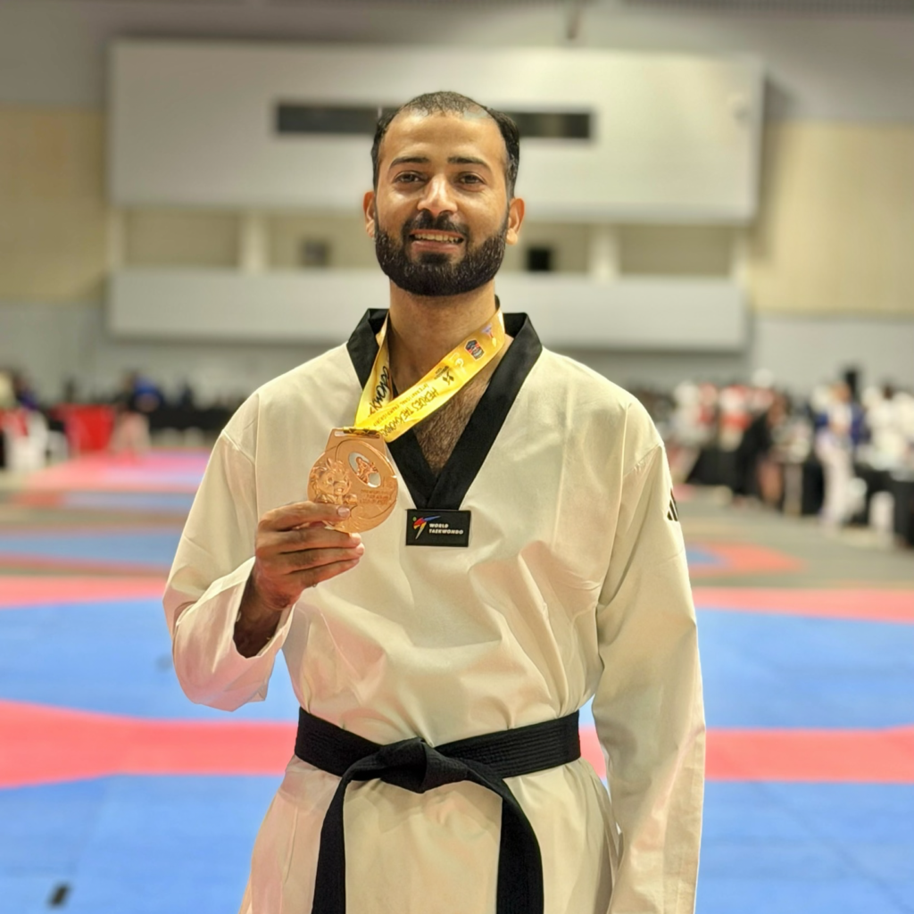 Hussain Anjum of Khubaib Foundation holding his bronze medal at the Heroes Cup Taekwondo Championship in Thailand