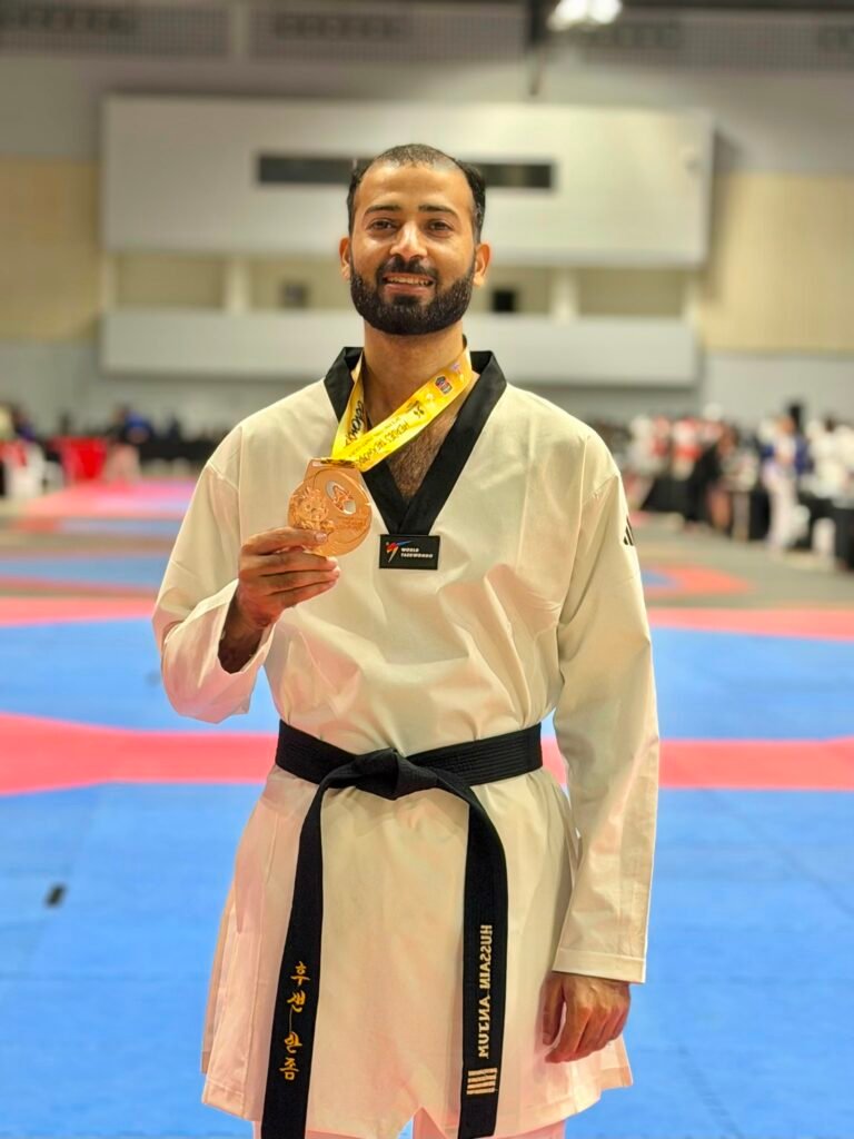Hussain Anjum of Khubaib Foundation holding his bronze medal at the Heroes Cup Taekwondo Championship in Thailand